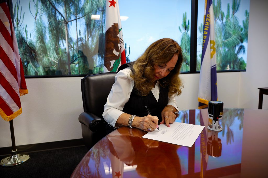 Assessor Josie Gonzales signs Supplemental Roll #136